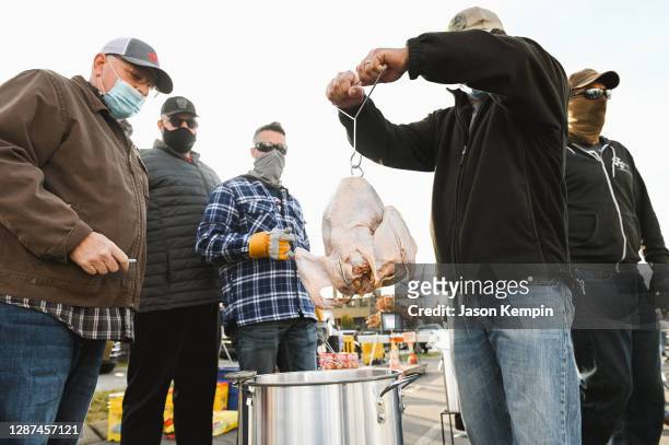 Participants are seen deep frying turkey on November 24, 2020 in Nashville, Tennessee.