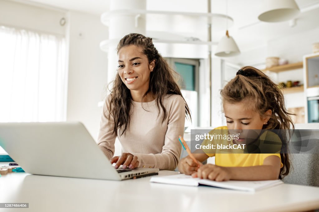Young African American Mother Working From Home High-Res Stock Photo