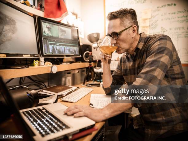 male video editor working at home - film editor stock pictures, royalty-free photos & images