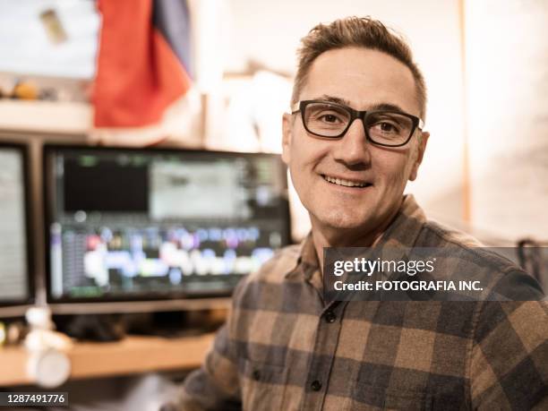 male video editor working at home - film editor stock pictures, royalty-free photos & images