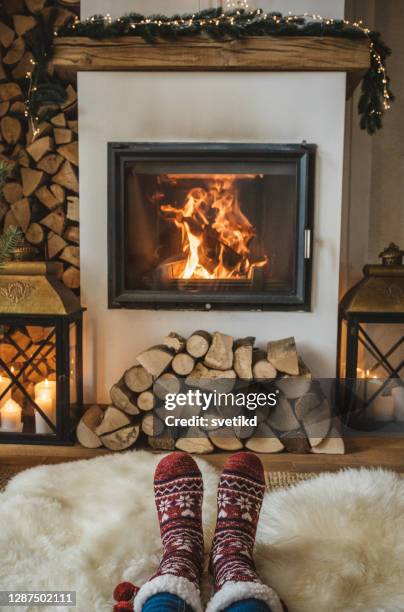 winter day by fireplace - feet christmas stock pictures, royalty-free photos & images