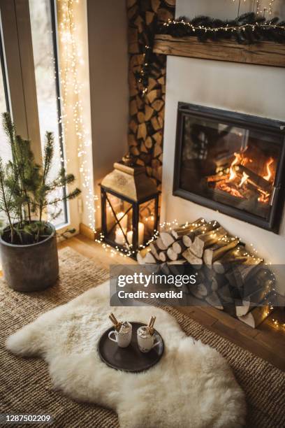 cozy place for rest - living room christmas fireplace stock pictures, royalty-free photos & images