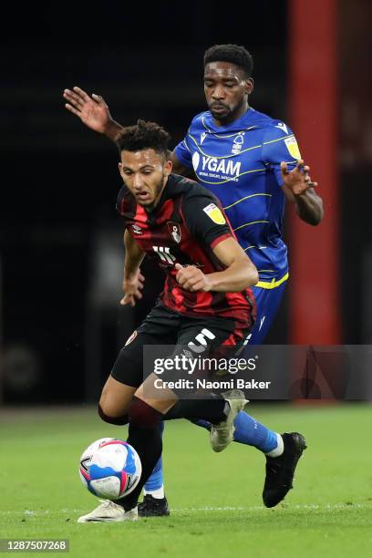 Lloyd Kelly of AFC Bournemouth battles for possession with Sammy Ameobi of Nottingham Forest during the Sky Bet Championship match between AFC...