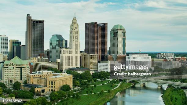 downtown skyline of columbus, ohio from over scioto river - aerial - columbus ohio aerial stock pictures, royalty-free photos & images