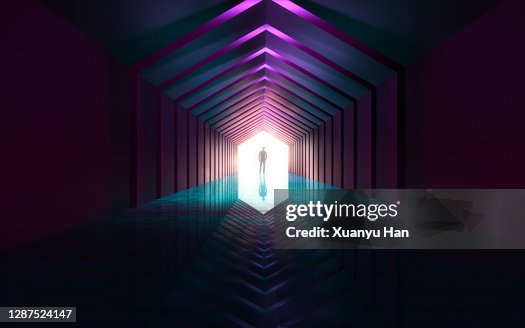 Man standing in empty futuristic passage Man standing in empty futuristic passage