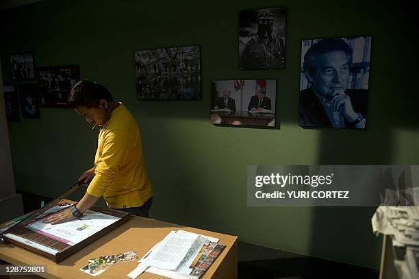 Production team member works during the recording of a scene of "El Octavo Mandamiento" soup opera at the Argos studios in Tlalnepantla, state of...