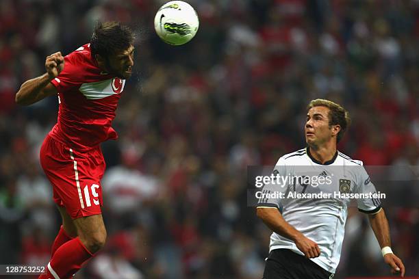 Mario Goetze of Germany battles for the ball with Egemen Korkmaz of Turkey during the UEFA EURO 2012 Group A qualifying match between Turkey and...