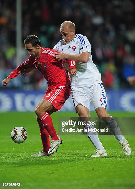 Roman Sirokov of Russia battles with Jan Durica of Slovakia during the EURO 2012, Group B qualifier between Slovakia and Russia at the MSK Zilina...