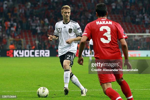 Marco Reus of Germany battles for the ball with Hakan Balta of Turkey during the UEFA EURO 2012 Group A qualifying match between Turkey and Germany...