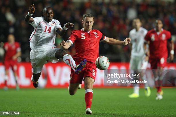 Innocent Emeghara of Switzerland challenges Darcy Blake of Wales during the EURO 2012 Qualifying Group G match between Wales and Switzerland at the...