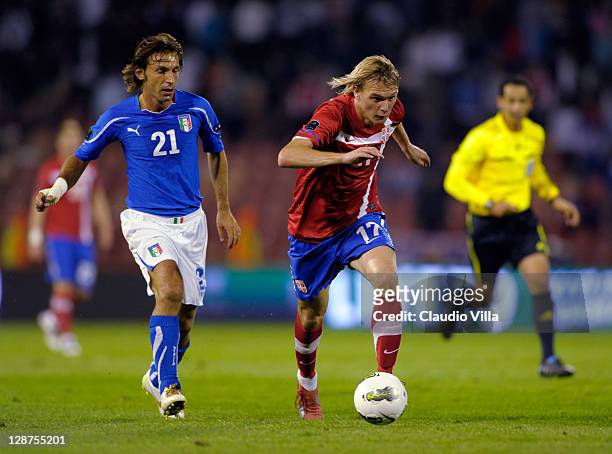 Milos Krasic of Serbia and Andrea Pirlo of Italy during the EURO 2012 Qualifier match between Serbia and Italy at Stadion Crvena Zvezda on October 7,...