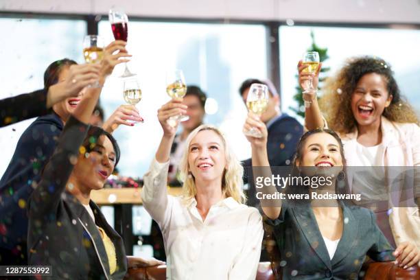 office party celebrate and toasting wine employee appreciation day - employee appreciation day stock-fotos und bilder