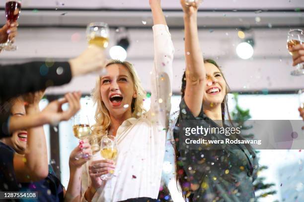 office party celebration and toasting wine - employee appreciation day stock-fotos und bilder