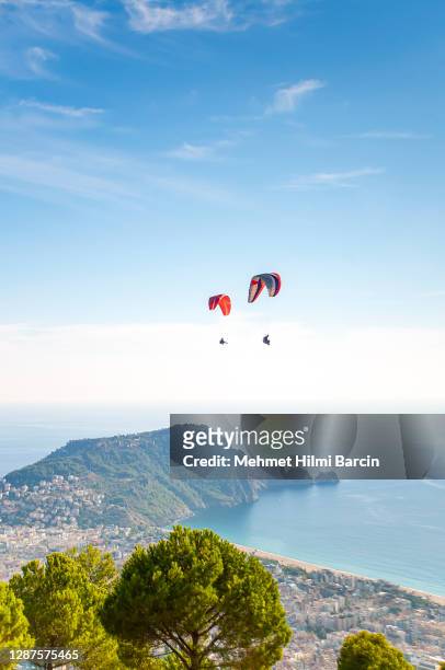 tandem paragliding - antalya province stock pictures, royalty-free photos & images