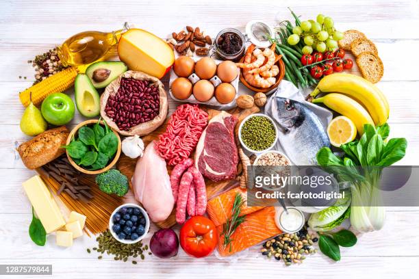 food backgrounds: table filled with large variety of food shot from above - food pyramid stock pictures, royalty-free photos & images