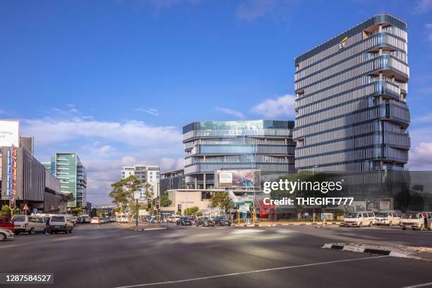 sandton city rivonia road with ernest young building - sandton cbd stock pictures, royalty-free photos & images
