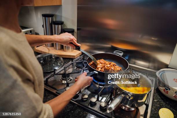 preparing dinner for family - stir frying european stock pictures, royalty-free photos & images