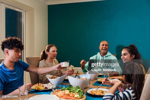 quality time as a family - family dinner stock pictures, royalty-free photos & images