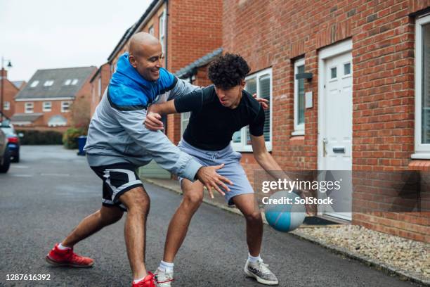 father son bonding - british basketball stock pictures, royalty-free photos & images