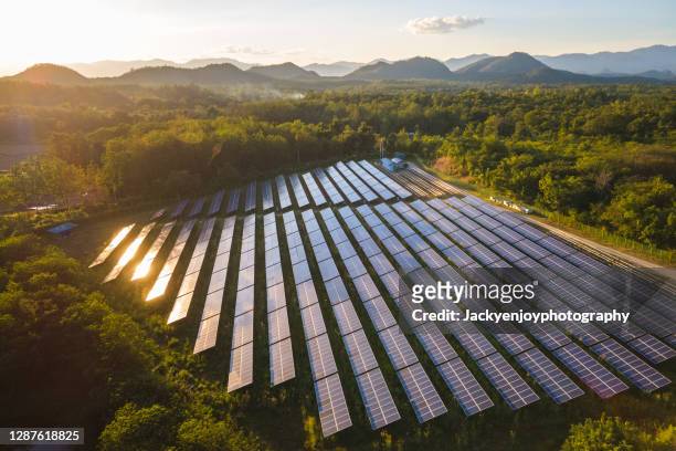 aerial view of solar power station and solar energy panels - wind power station stock pictures, royalty-free photos & images