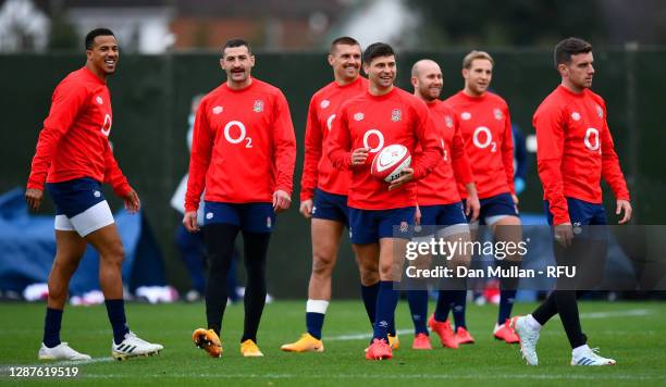 Anthony Watson, Jonny May, Henry Slade, Ben Youngs, Dan Robson, Max Malins and George Ford of England smile during the England Training Session at...