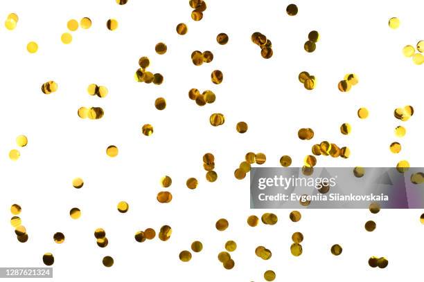 bunch of gold circles confetti on white background. - confetti gold ストックフォトと画像