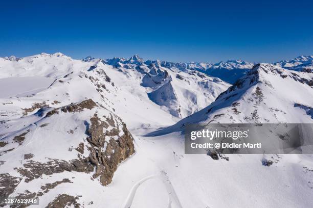 dramatic aerial view of the alps in canton valais, above the crans-montana resort, in switzerland - crans montana stock-fotos und bilder