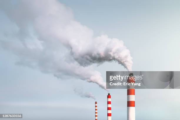 smoking chimneys - luftverschmutzung stock-fotos und bilder