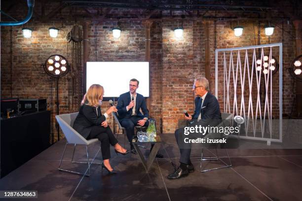 businesswoman and businessmen during seminar - press conference stage stock pictures, royalty-free photos & images