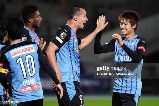 Leandro Damiao of Kawasaki Fronale celebrates his side's second goal with team mate during the J.League Meiji Yasuda J1 match between Kawasaki...