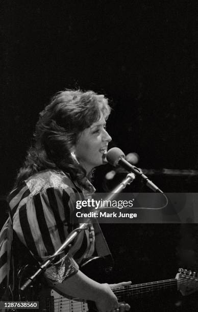 Bonnie Raitt performs during the warmup act of a Soul to Soul Tour concert featuring Stevie Ray Vaughan and his Double Trouble band at Red Rocks...