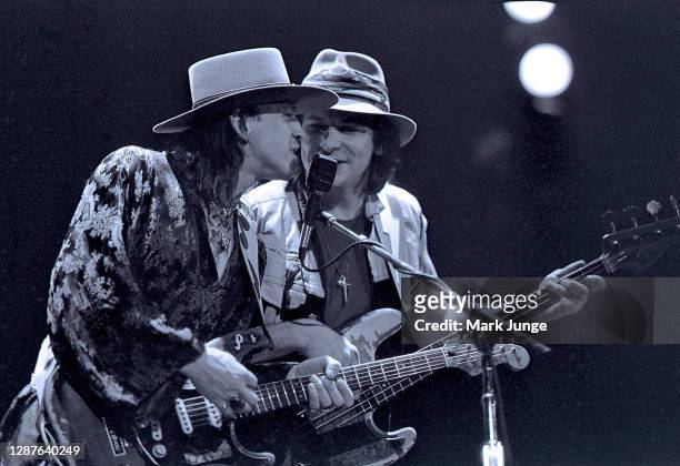 Stevie Ray Vaughan is accompanied by his Double Trouble band bass player, Tommy Shannon, during a Soul to Soul Tour concert at the University of...