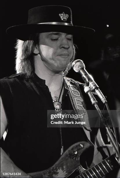 Stevie Ray Vaughan plays his guitar during a concert at the Red Rocks Amphitheater on June 17, 1987 in Morrison, Colorado. The image was tinted by...