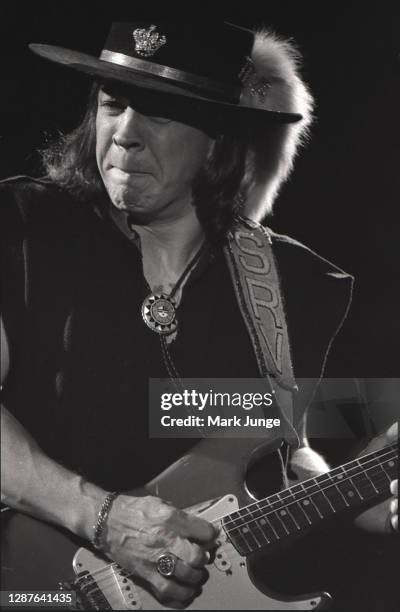 Stevie Ray Vaughan plays his guitar during a concert at the Red Rocks Amphitheater on June 17, 1987 in Morrison, Colorado. The image was tinted by...