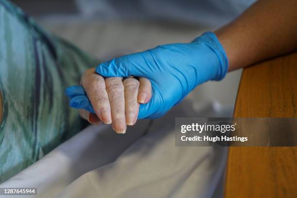 Della Lilley visits and holds her mother, 89-year old Betty Whiteman, for the first time in two months after successfully passing a rapid Covid-19...