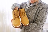 New mens leather brown waterproof winter autumn boots in hands