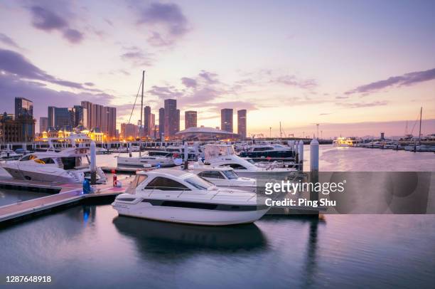 yacht wharf by the sea of dalian - moored stock pictures, royalty-free photos & images