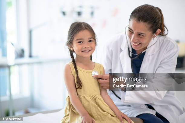 girl goes for medical check up - child and doctor stock pictures, royalty-free photos & images