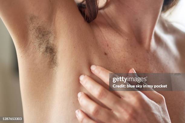 natural feminine body hair - armpit hair woman stock pictures, royalty-free photos & images