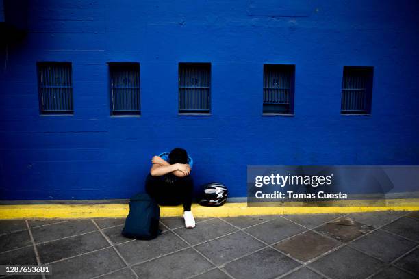 Fan cries after the news of the death of Diego Maradona was known at Boca Junior's Bombonera Stadium on November 25, 2020 in Buenos Aires, Argentina....