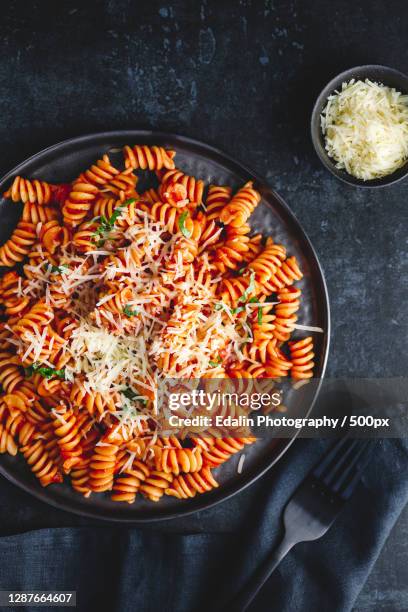 directly above shot of pasta in bowl on table - whole wheat stock pictures, royalty-free photos & images