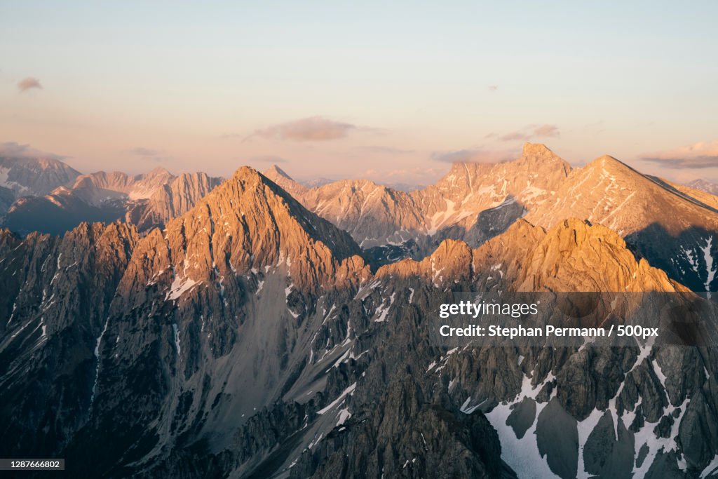 Panoramic view of snowcapped mountains against sky