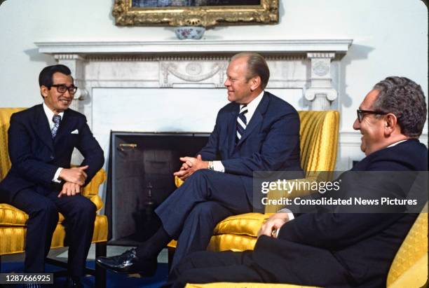 View of, from left, South Vietnamese Ambassador to the US Tran Kim Phuong, US President Gerald Ford , and Secretary of State Henry Kissinger,...