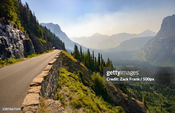 scenic view of mountains against sky - going to the sun road stock pictures, royalty-free photos & images