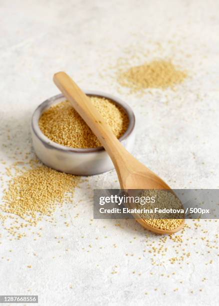 close-up of powdered sugar in spoon on table - amarant stock pictures, royalty-free photos & images