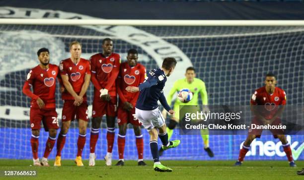 Jed Wallace of Millwall FC scores his teams first goal from a free kick during the Sky Bet Championship match between Millwall and Reading at The Den...