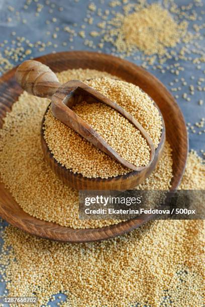 close-up of wheat in bowl on table - amarant stock pictures, royalty-free photos & images