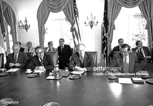 President Gerald Ford briefs his cabinet, in the White House's Cabinet Room, Washington DC, June 29, 1976. He had just returned from a two-day...