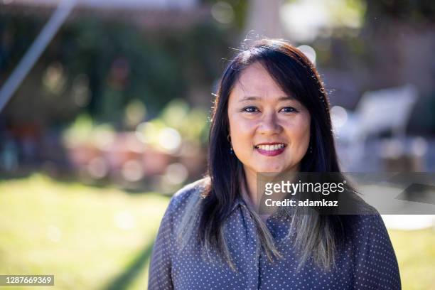 portrait of a mature filipino woman - philippines women stock pictures, royalty-free photos & images