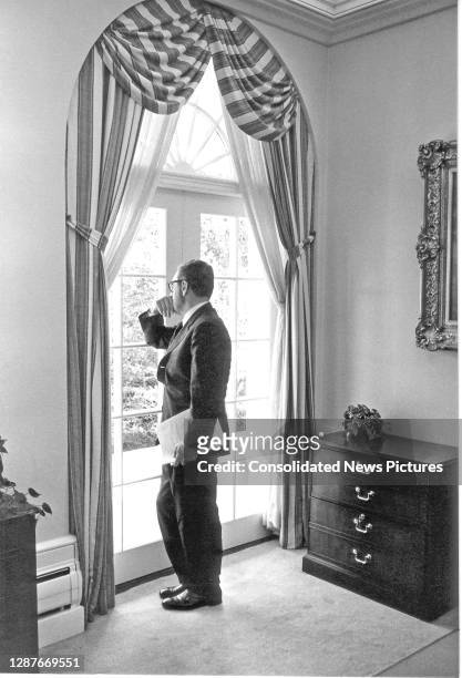 View of US National Security Advisor Henry Kissinger as he stands at a window in the White House, Washington DC, September 21, 1970.